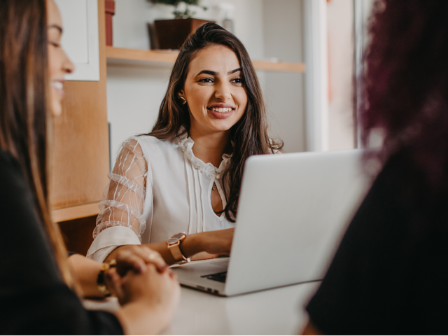 Office assistant holds meeting with team